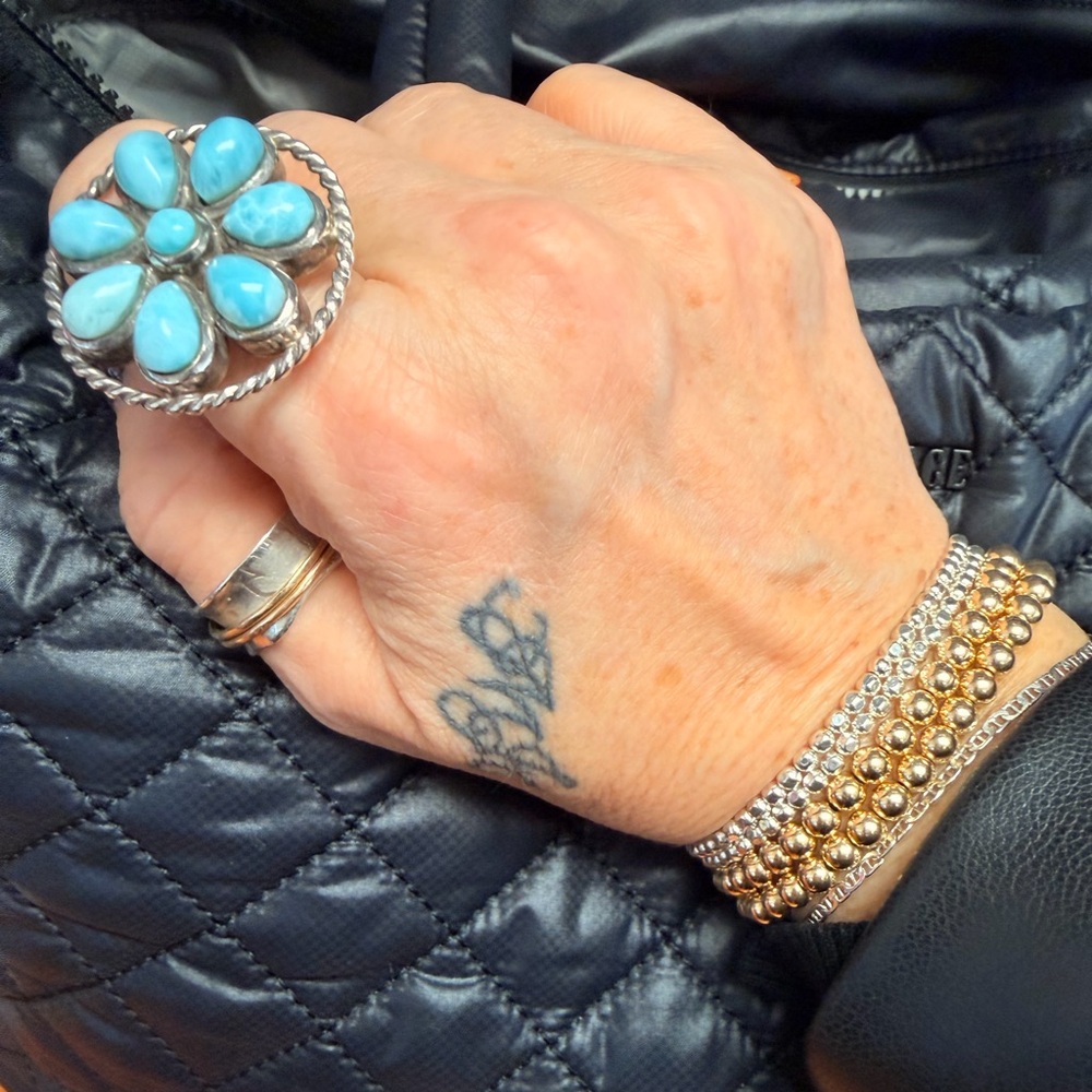 925 Sterling silver turquoise adj. Flower ring 6-10 sturdy has a good weight